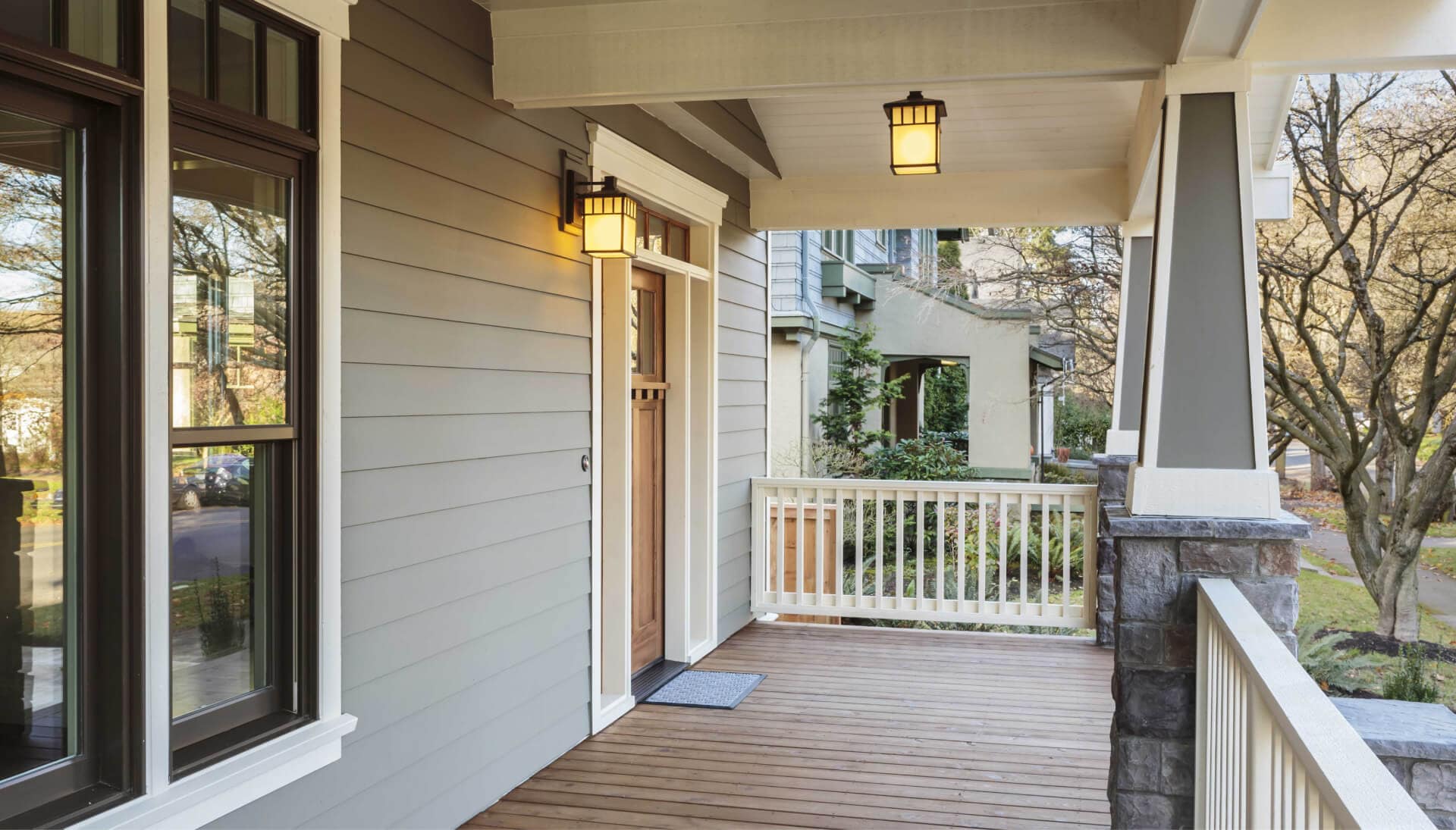 A beautifully designed wrap-around porch with elegant railing and ample space for entertaining guests in Lancaster